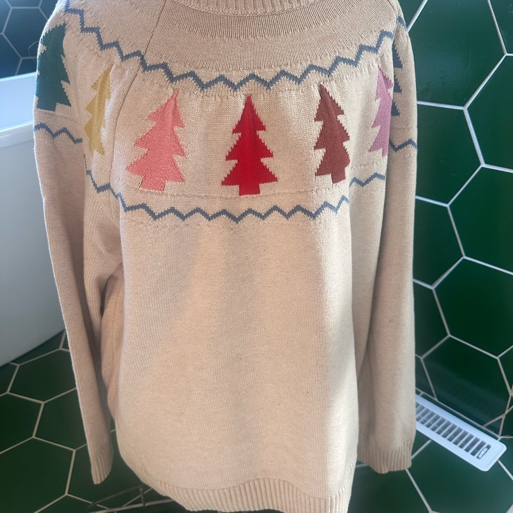 Hanna Andersson sweater with tree pattern.